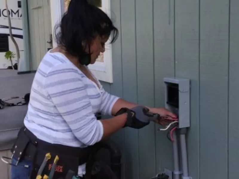 Licensed electrician wiring an exterior subpanel in Bernards